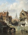 View of a canal in a Dutch town - Charles Henri Leickert
