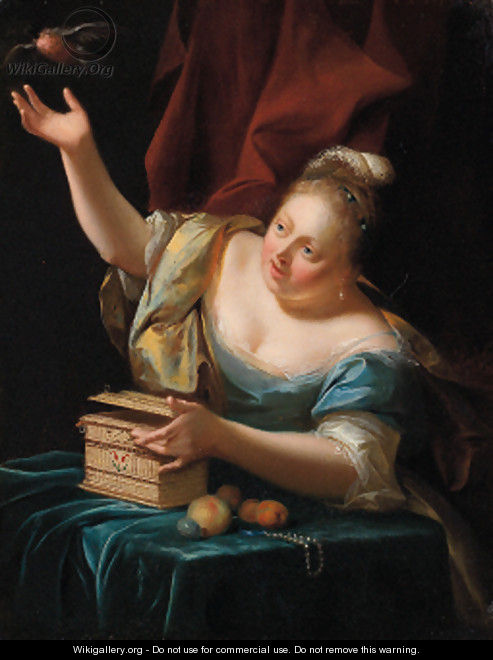 A woman, seated by a table in fancy costume, freeing a songbird from its cage - Godfried Schalcken