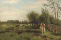 Cows in a meadow in spring, a church beyond - Geo Poggenbeek