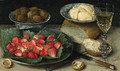 Strawberries on a Plate, Walnuts in a porcelain Bowl, Butter on a Plate, a Loaf of Bread, a faon de venise Wine Glass, a Knife and a Fork on a Table - Georg Flegel