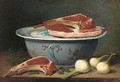 A pottery bowl, cuts of meat and onions on a table - French School