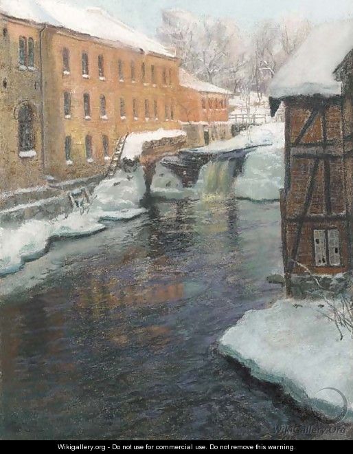 A River Cascade among Factory Buildings on a Winter