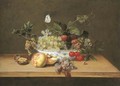 Grapes on the vine, whitecurrants, blackberries, cherries and a walnut in a porcelain bowl with peaches, grapes and a walnut - Frans Ykens