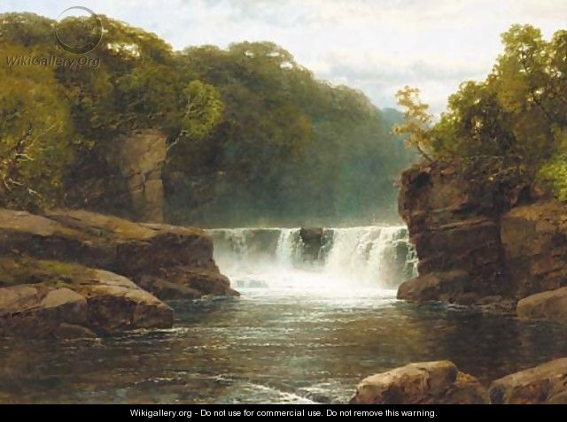 A waterfall in a wooded river valley - John Brandon Smith