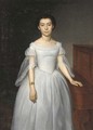 Portrait of a girl, standing, three-quarter length, in a white dress beside a piano - Louis Loyeux
