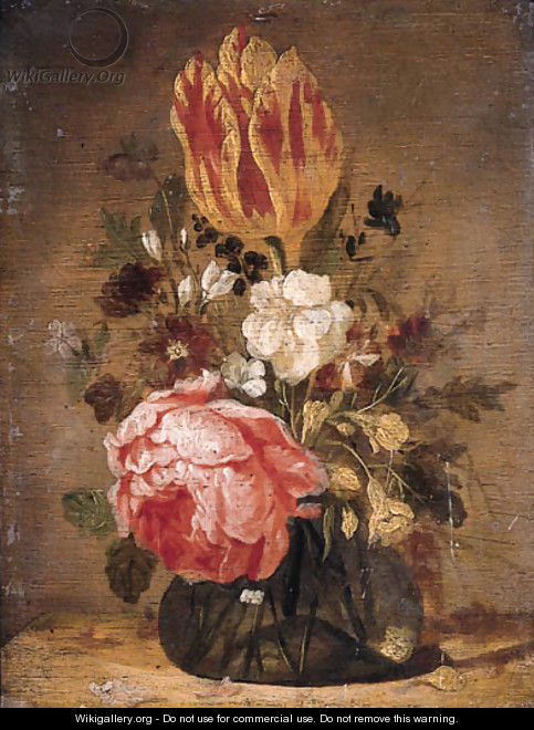 A tulip, a rose, a violet and other flowers in a glass vase on a wooden table - Jacques de Claeuw