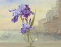 Irises in a glass vase with Venice beyond - Russian School