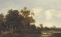 A wooded river landscape with hunters on a path - Pieter Jansz. van Asch