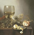 A giant roemer, an upturned roemer, grapes on the vine, a roll of bread, a knife and a partly-peeled lemon on a platter on a draped table - Pieter Claesz.