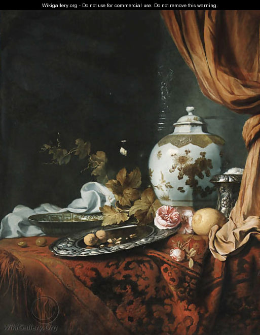 A blue and white facetted vase with other dishes, glasses, fruit and roses on a draped table - Simon Luttichuys