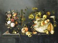 Tulips, carnations and other flowers in a vase, grapes and peaches in a porcelain bowl, with glasses of wine, a peeled lemon on a dish and other fruit - Michiel Simons