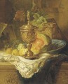 Fruits and a gilt auricular cup and cover on a ledge - Maria Vos