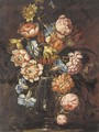 Carnations, tulips, daffodils, roses and other flowers in a glass vase on a ledge - (after) Juan De Arellano