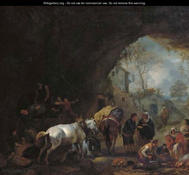 A grotto with travellers unloading a wagon, a gypsy fortune-teller, a blacksmith and other figures - Philips Wouwerman