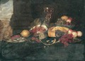 Still Life Of Fruit In A Blue-And-White Porcelain Bowl, Grapes, Peaches, A Pie, Peeled And Whole Lemons On Pewter Plates, Shrimp, A Ham, And An Ormolu Tazza Behind, All Set Upon A Table - (after) Jan Davidsz. De Heem