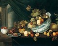 Still Life With Fruit Tumbling From A Porcelain Bowl, On A Wooden Table - Michiel Simons