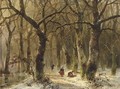 Woodgatherers on a forest path in winter - Andreas Schelfhout