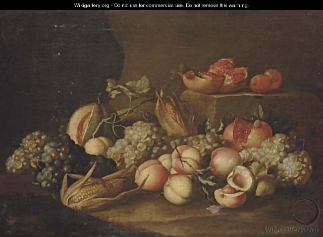 Peaches, grapes, corn on the cob, pomegranates and a melon on a stone floor - Alexander Coosemans