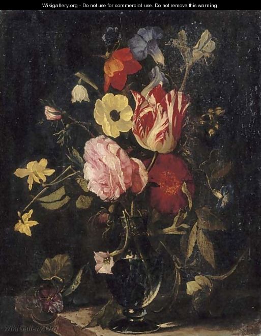 Roses, tulips, an iris, pansies and an anemone in a glass vase on a stone ledge - (after) Daniel Seghers