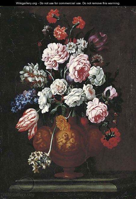 Roses, carnations, tulips and other flowers in a sculpted urn on a stone ledge - (after) Giovanni Stanchi