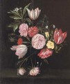 Parrot tulips, roses, carnations and other flowers in glass vase on a stone ledge - (after) Daniel Seghers
