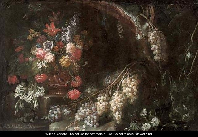 Roses, carnations, narcissi and other flowers in a gilt urn with grapes in a wooded clearing - (after) Nicola Malinconico