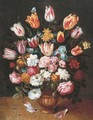 Tulips, daffodils, roses, an iris and other flowers in a pottery vase on a ledge - (after) Osias, The Younger Beert