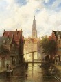 A view of a town with figures by a drawbridge - Charles Henri Leickert