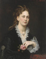 Portrait of Antonie Freifrau von Doblhoff, bust-length, holding a rose - Carl Von Blaas