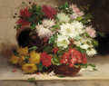 Chrysanthemums and Geraniums in a basket on a ledge - Eugene Henri Cauchois
