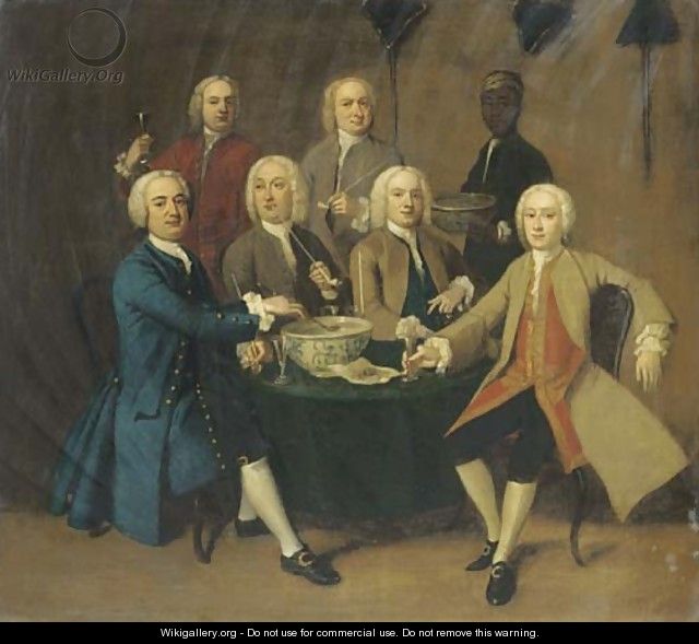 Gentlemen drinking and smoking pipes round a table in an interior, a servant bearing a bowl of punch - English School