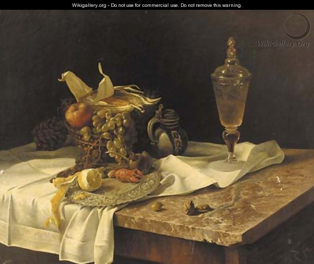 A lobster, fruit, a jug and a vessel of wine on a marble table - Dutch School