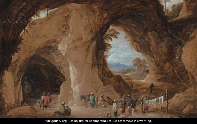 Gypsies at a grotto with a traveller having his fortune told - David III Teniers