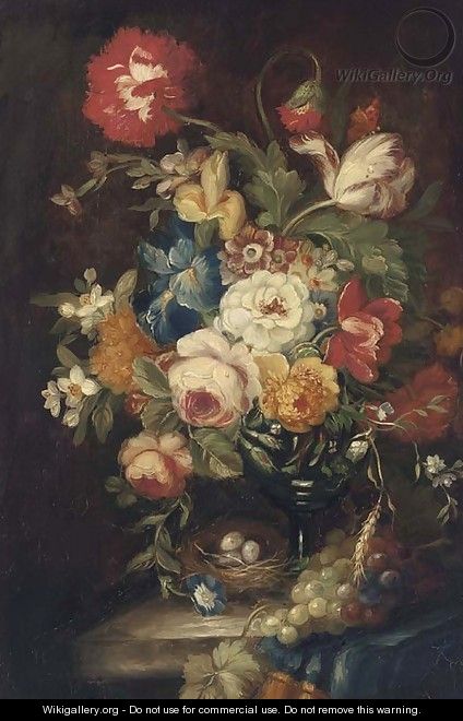 Summer flowers in a vase on a stone ledge with a bird