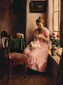 A girl in a pink dress sewing by the window - Emil Pap