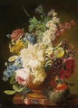 A Still Life Of Mixed Flowers Including Roses, Poppies And Narcissi In A Stone Vase, Together With A Bird