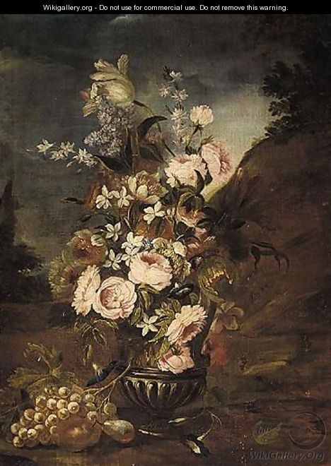 Still Life Of Roses, Lilies, And Other Flowers, In A Glass, Together With Some Some Grapes And A Pear In A Parkland Setting - Italian School