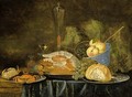 A Still Life With A Ham, A Bun, Crabs On Pewter Plates, Peaches In A Blue And White Bowl And Wine Glasses Together With Grapes, All On A Draped Table - (after) Jan Van Den Hecke