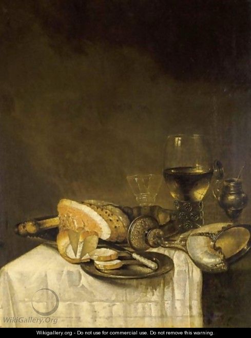 A Still Life With A Nautilus Cup, A Roemer, A Wineglass, A Ham, Bread And A Knife On Pewter Plates Together With A Silver Gilt Mustard Jar, All On A Table Draped With A White Tablecloth - (after) Willem Claesz. Heda