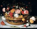A Basket Of Tulips, Carnations, Roses And Other Flowers Resting On A Stone Ledge - (after) Jan The Elder Brueghel