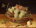 A Still Life With Blue And White Grapes In A Basket, Together With Red Currants, Hazelnuts And A Peach, All On A Wooden Ledge - (after) Isaak Soreau