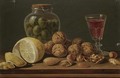 Still Life With Walnuts, Olives In A Glass Jar, A Partly Peeled Lemon And A Glass Of Red Wine - Miguel Parra