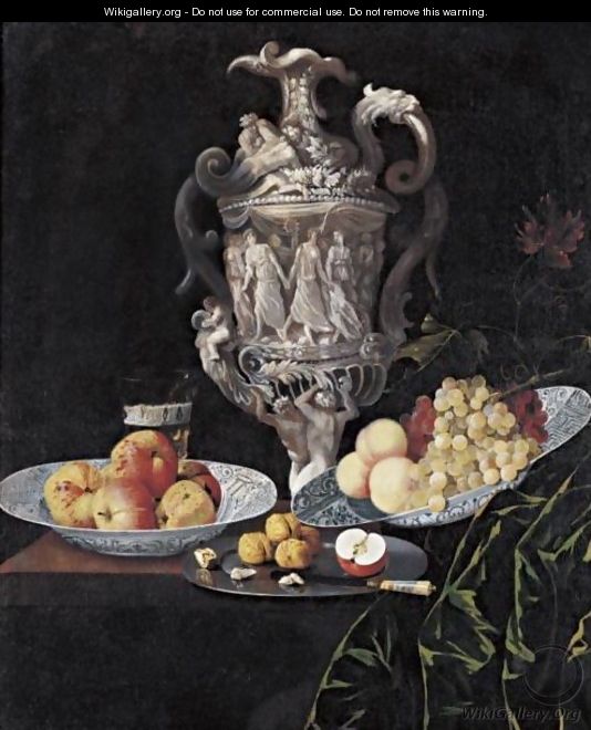 Still Life With An Elaborately Sculpted Urn And Blue And White Porcelain Bowls With Fruit - Georg Hinz
