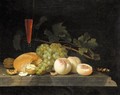 A Still Life With Peaches, Grapes, Walnuts, Bread, A Half Filled Flute, Vine Leaves And A Knife Handle On A Stone Ledge - Gillis Jacobsz. Van Hulsdonck