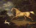 A Palomino frightened by an approaching storm with a spaniel - Charles Towne