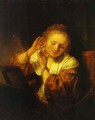 A Young Woman Trying on Earings - Rembrandt Van Rijn