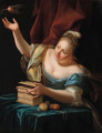 A woman, seated by a table in fancy costume, freeing a songbird from its cage - Godfried Schalcken