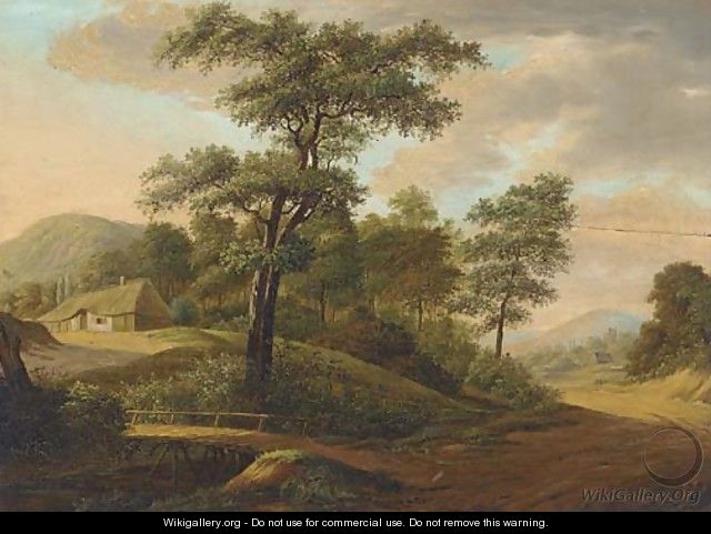An extensive wooded river landscape with a town beyond - German School
