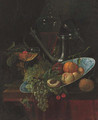 Fruit in a Kraak dish with a pewter ewer and two glasses on a partially draped table - (after) Willem Kalf