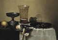 A peeled lemon, a knife and hazel-nuts on pewter plates - (after) Willem Claesz. Heda